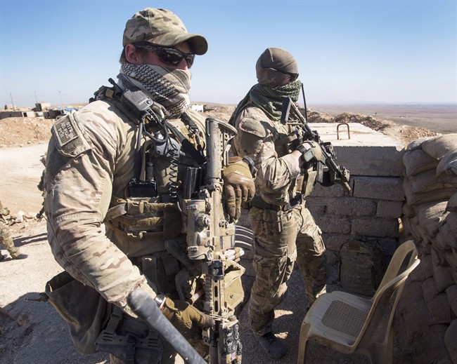Canadian special forces look over a Peshmerga observation post, Monday, February 20, 2017 in northern Iraq. 