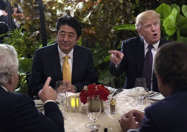 President Donald Trump sits down to dinner with Japanese Prime Minister Shinzo Abe at Mar-a-Lago in Palm Beach, Fla., Feb. 10, 2017.