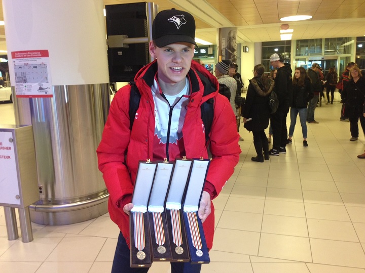Tyson Langelaar displays his four medals that he won at the World Junior Long Track Championships in Finland.