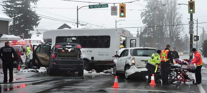 VANCOUVER, BC., February 9, 2017 --  Vancouver Police and Emergency Paramedics on scene at a motor vehicle accident involving two cars and a Sunrise Seniors Living van at Oak St and 57th Ave, in Vancouver, BC., February 9, 2017. 