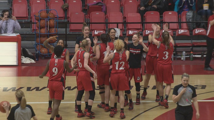 The Winnipeg Wesmen celebrate a game three victory over the Victoria Vikes in the Canada West quarterfinals.