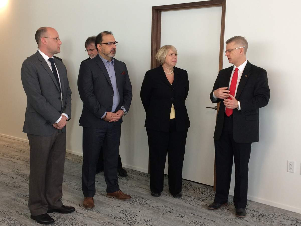 Mayor Matt Brown, Energy Minister Glenn Thibeault, Deputy Premier Deb Matthews, and Sifton Properties President Richard Sifton gather for a news conference detailing the development of the West 5 community.