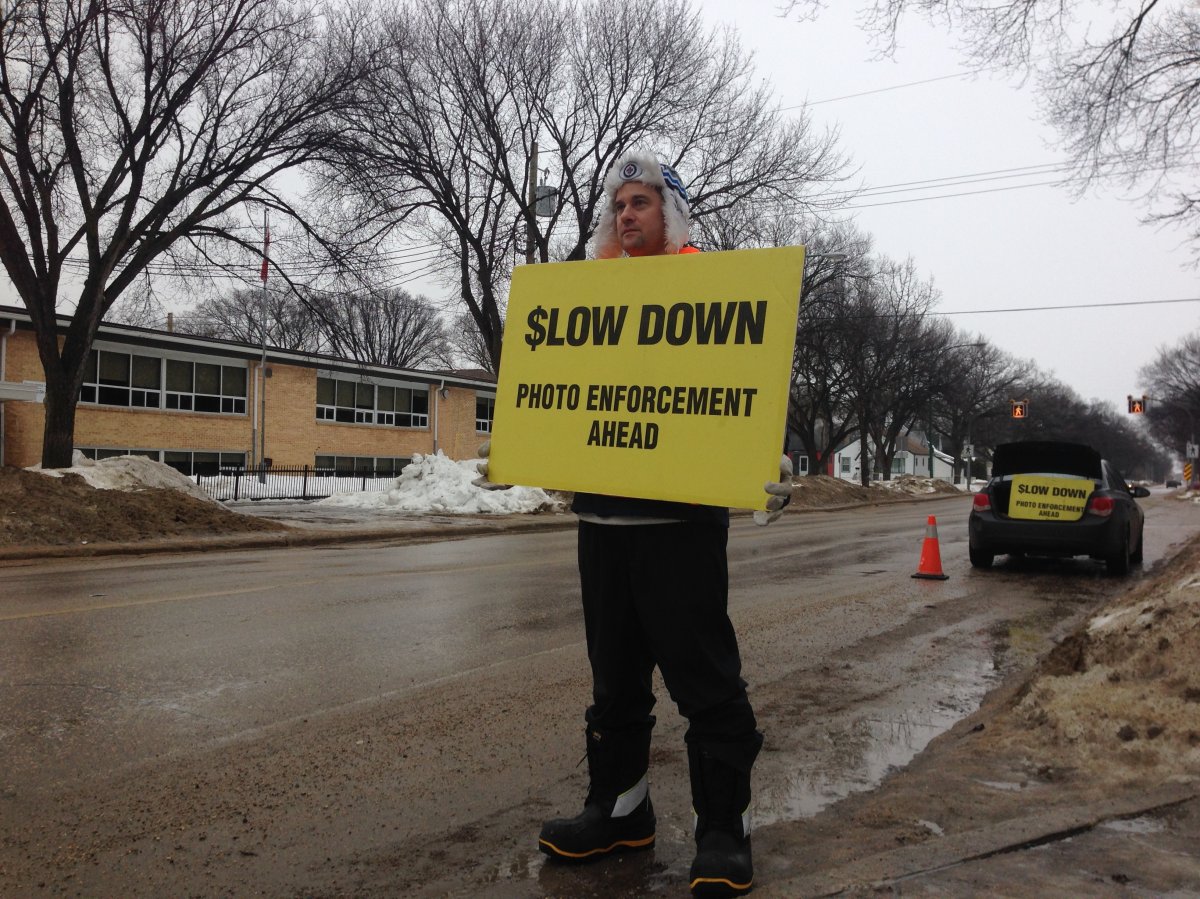 WiseUp Winnipeg member Justin Kiezik spent his morning on Louis Riel Day warning drivers of photo enforced radar.