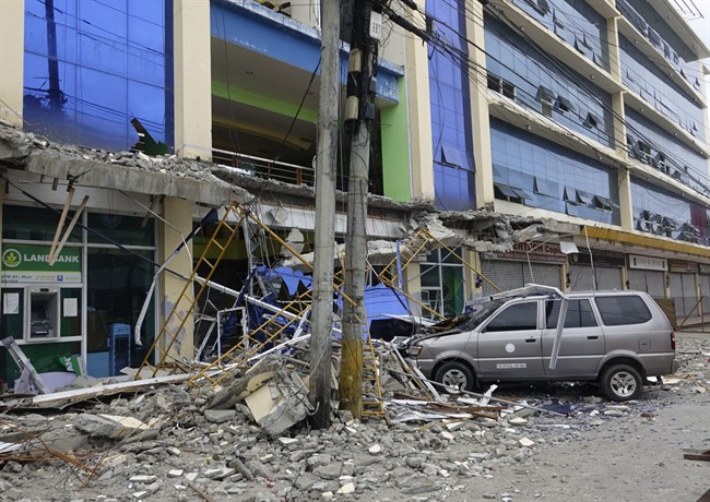Fallen debris from a building are seen Saturday, Feb. 11, 2017 following a powerful nighttime earthquake that rocked Surigao city, Surigao del Norte province in southern Philippines. Natural disasters make the list of the most likely threats we will face in 2017. (AP Photo).
