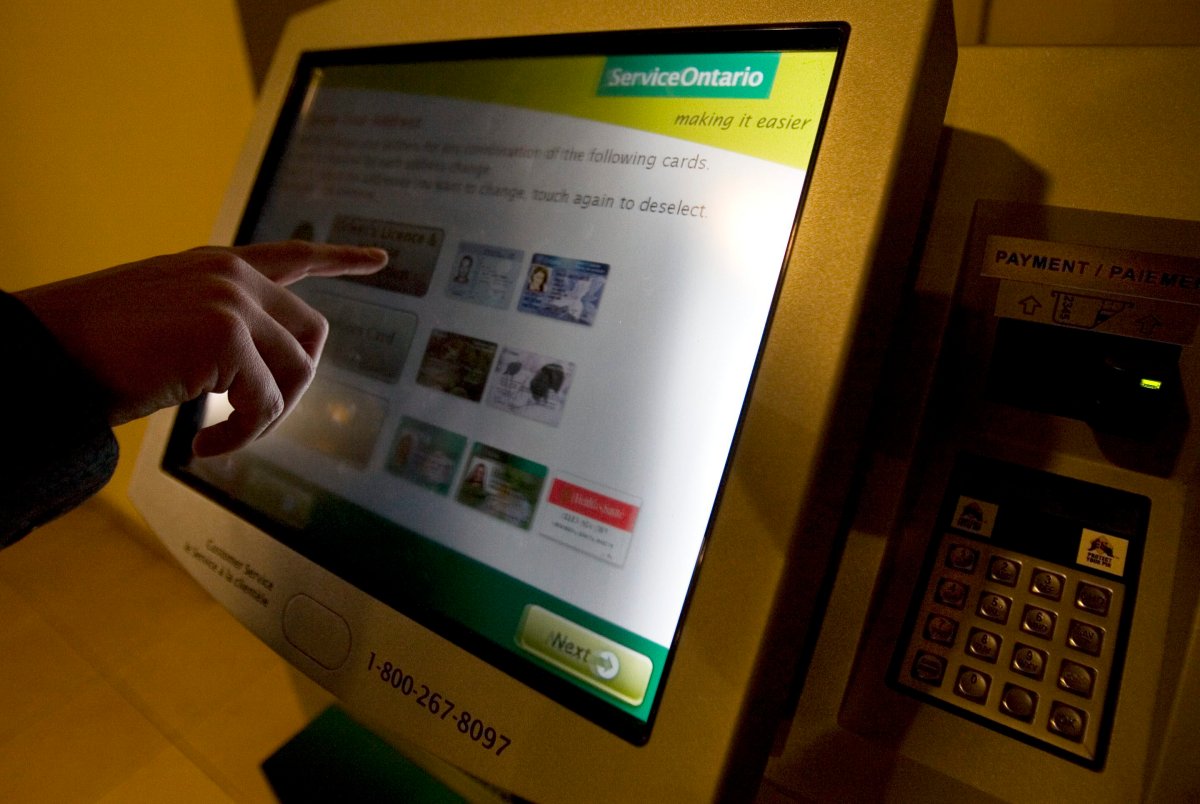 Generic image of people using the Ontario Government kiosks to renew or update provincial documents such as licenses, outdoor cards, health cards, etc.  