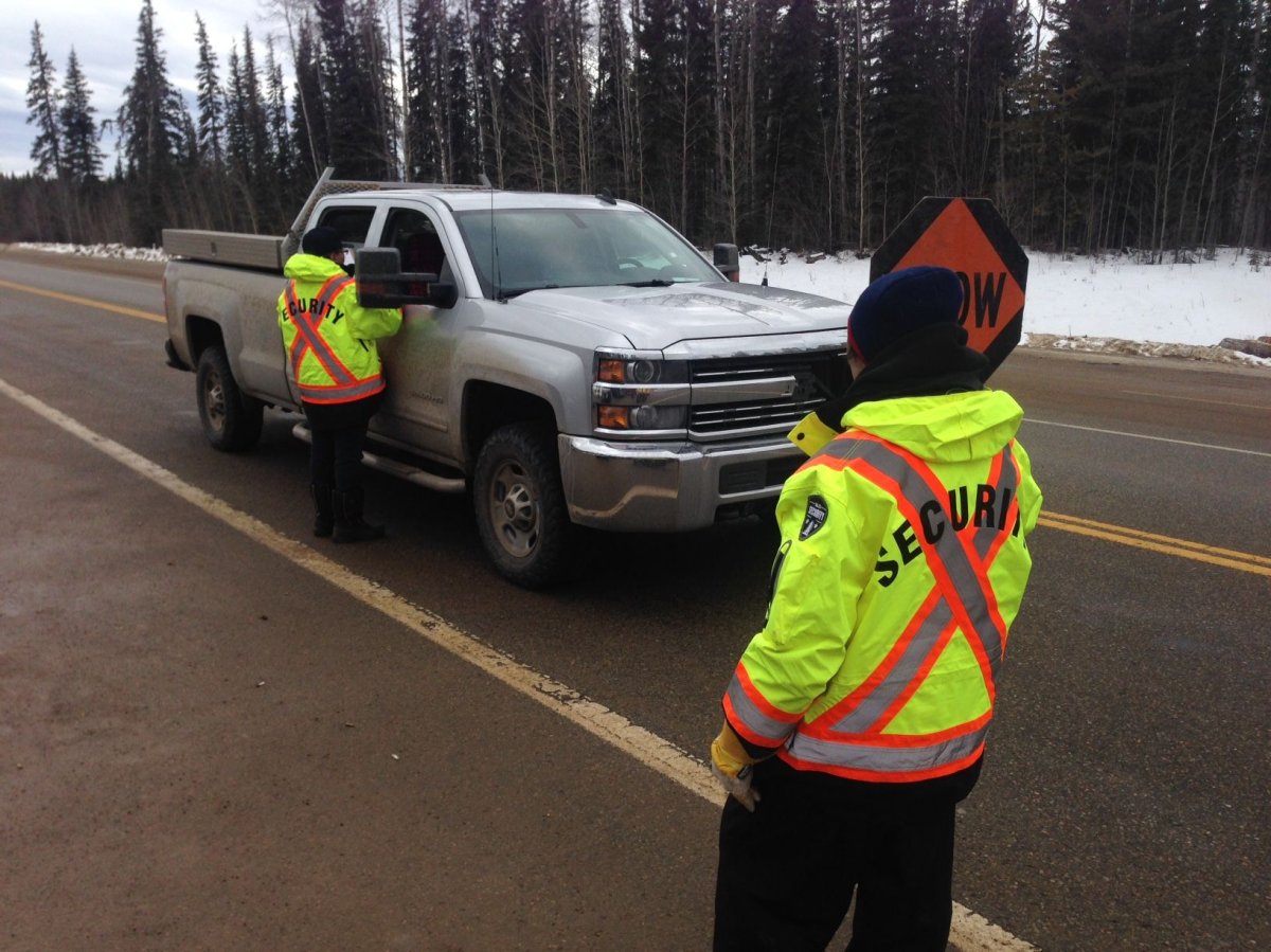 Members of the Bigstone Cree Nation stop drivers on Highway 813 north of Calling Lake, Alta. March 15, 2017.