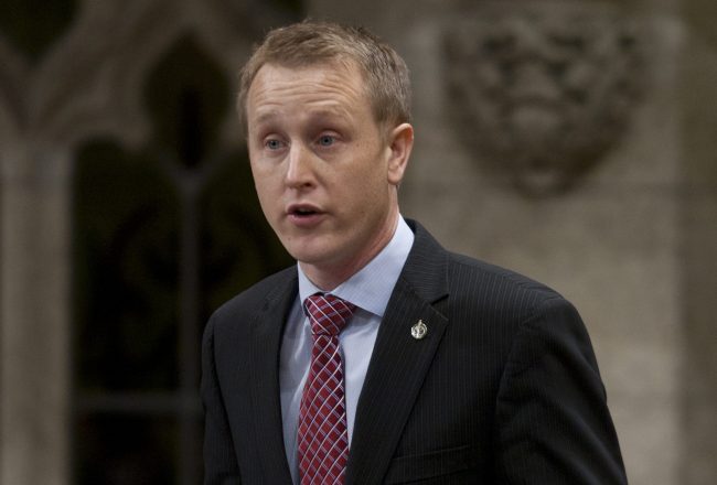 Conservative MP Chris Warkentin rises during Question Period in the House of Commons in Ottawa, Friday February 17, 2012. 