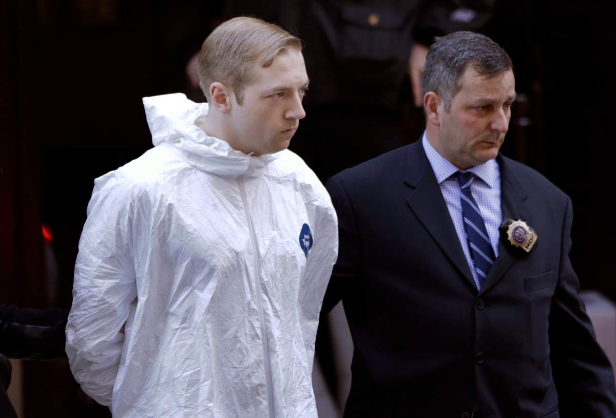 James Harris Jackson is escorted out of a police precinct in New York, Wednesday, March 22, 2017.