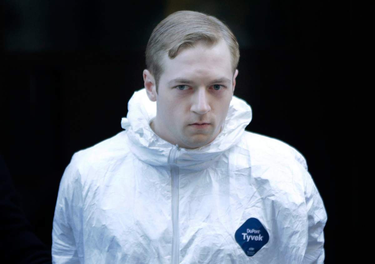 James Harris Jackson is escorted out of a police precinct in New York, Wednesday, March 22, 2017. Police said Jackson, accused of fatally stabbing a black man in New York City, told investigators he traveled from Baltimore specifically to attack black people.