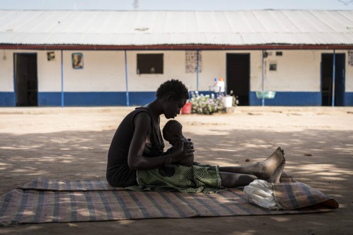 A young mother cradles her malnourished child near Aweil, in South Sudan, in March 2017. Ottawa has pledged to match all donations to a yet-to-be created famine relief fund.