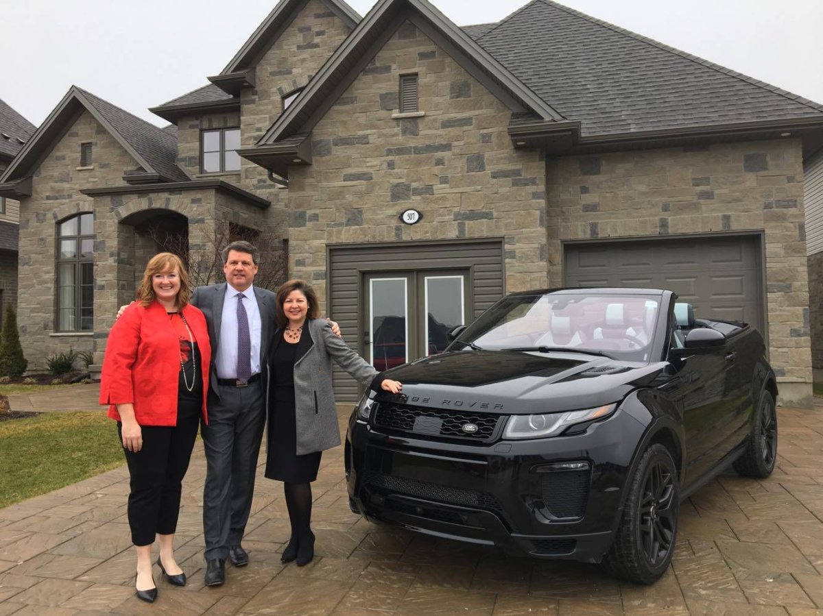 From left, Sherry Bocchini, chief development officer for Children’s Health Foundation, ohn MacFarlane, president and CEO of London Health Sciences foundation and Michelle Campbell, president and CEO of St. Joseph’s Health Care foundation standing in front of dream luxury home at 507 Bradwell Chase.