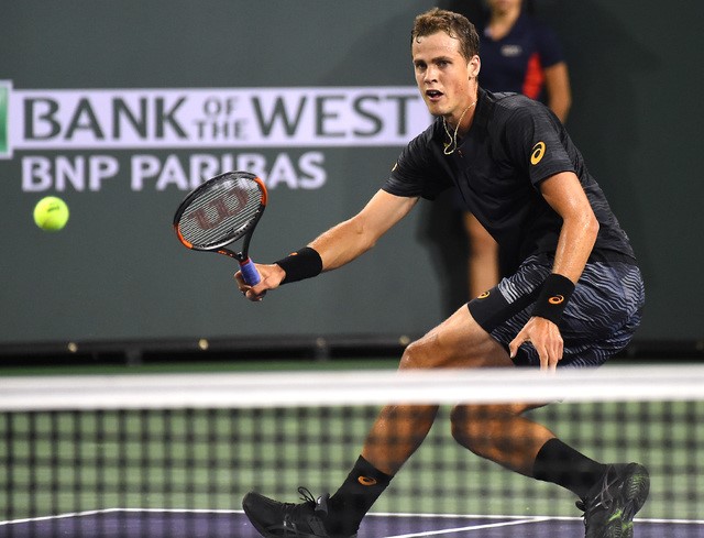 Indian Wells, CA, Vasek Pospisil (CAN) hits a ball as he defeated Andy Murray (not pictured) in his 2nd round match in BNP Paribas Open at the Indian Wells Tennis Garden. 
