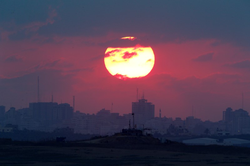 The sun sets over the Gaza Strip, as seen from the Israeli side, September 2016.    