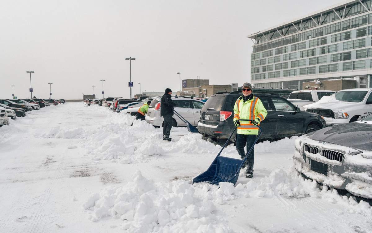 Pierre Elliott Trudeau Airport employees were out clearing snow-covered cars to make things a little easier for travellers, Thursday, March 16, 2017.