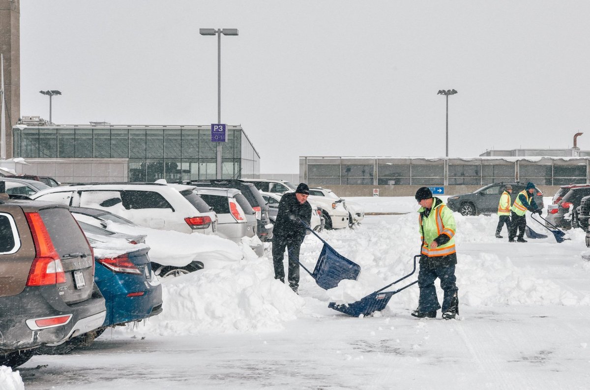 Pierre Elliott Trudeau Airport employees were out clearing snow-covered cars to make things a little easier for travellers, Thursday, March 16, 2017.