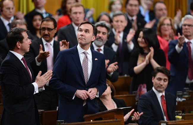 Liberal Members of Parliament give Minister of Finance Bill Morneau a standing ovation as he delivers the federal budget in the House of Commons on Parliament Hill in Ottawa, Wednesday March 22, 2017.