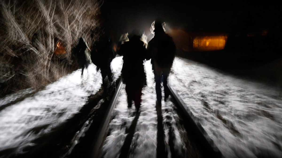 Asylum seekers from Somalia cross into Canada illegally from the United States by walking down a train track into the town of Emerson, Man., in this file photo.