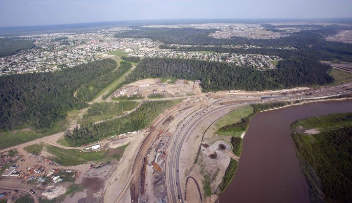 The Athabasca river, highway construction and suburbs seen from a helicopter in Fort McMurray, Alta., on July 10, 2012. The Alberta Energy Regulator is restricting how much water oilsands and other energy projects can withdraw from part of the Athabasca River and other rivers in the province. 