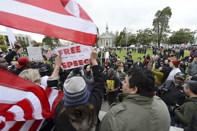 Trump supporters and anti-Trump protesters yell back and forth at a rally for President Donald Trump at Martin Luther King Jr. Civic Center Park in Berkeley, Calif., on Saturday, March 4, 2017. 