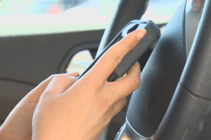 RCMP issue distracted driving warning after Alberta man wracks up 13th offence