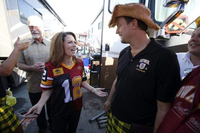 Mark Chelgren talks with U.S. Rep. Michele Bachmann while tailgating before an NCAA college football game in Ames, Iowa, Sept. 10, 2011.


).