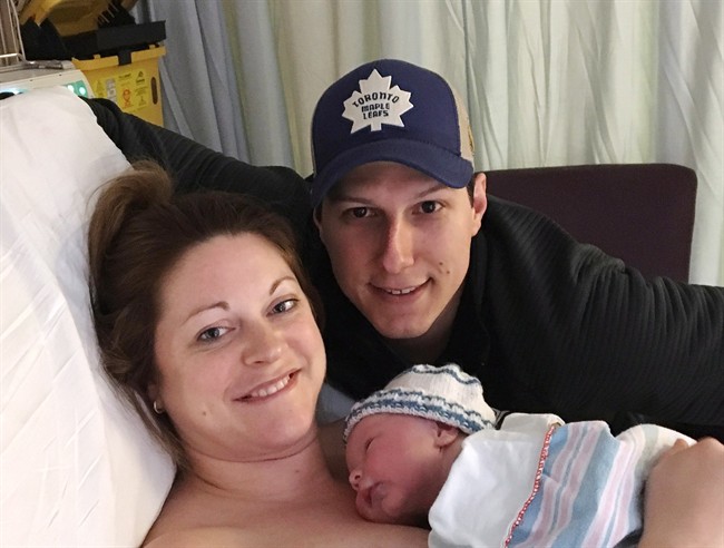 Lindsey Hubley and fiance Mike Sampson pose with their newborn baby Myles Owen Sampson at the IWK Health Centre in Halifax on March 2, 2017 in this handout photo.