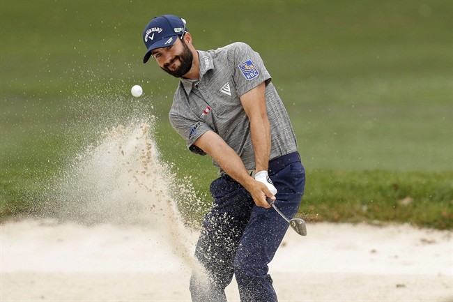 Adam Hadwin chips onto the first green during the final round of the Valspar Championship golf tournament Sunday, March 12, 2017, at Innisbrook in Palm Harbor, Fla. 