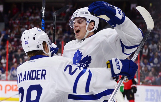 Toronto Maple Leafs center Auston Matthews celebrates a first period goal with teammate William Nylander during NHL hockey action in Ottawa on Wednesday, Oct. 12, 2016.