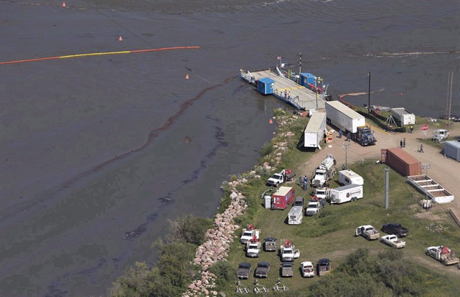 Crews work to clean up an oil spill on the North Saskatchewan river near Maidstone, Sask., in a July 22, 2016, file photo.
