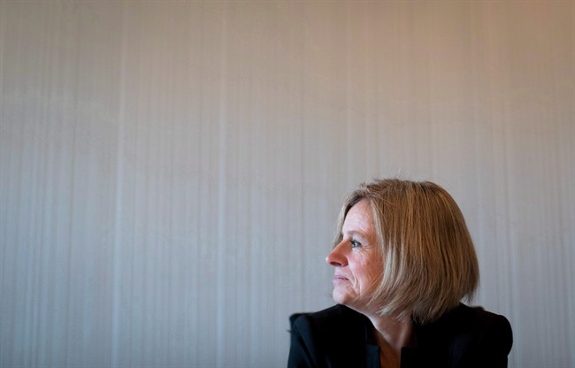 Alberta Premier Rachel Notley pauses to look out a window at Coal Harbour during an interview in Vancouver, B.C., on Tuesday December 6, 2016. 