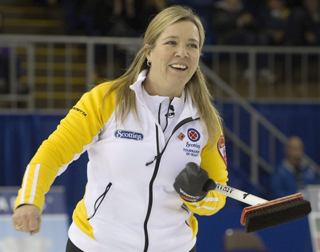 Manitoba skip Cathy Overton-Clapham smiles after making a shot against Team Canada in the night draw at the 2011 Tournament of Hearts in Charlottetown, P.E.I. on Feb. 23, 2011. Veteran curler Cathy Overton-Clapham has joined Chelsea Carey's curling team. Carey announced the move Wednesday on her team's Twitter account and said Overton-Clapham will compete with them in 2017-18. 