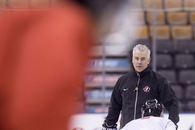 Canada's Head Coach Dominique Ducharme takes part in a practice session ahead of the IIHF World Junior Championship in Toronto on December 24, 2016. Ducharme will return as Canada's head coach at the 2018 world junior hockey championship in Buffalo, N.Y. 