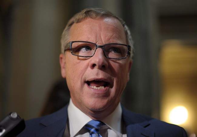 Premier Brad Wall speaks with members of the media following the 2017 budget speech at the Legislative Building in Regina Wednesday, March 22, 2017.