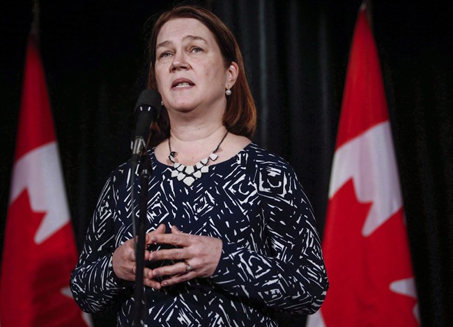 Health Minister Jane Philpott, speaks to reporters at a Liberal cabinet retreat in Calgary in a Jan. 23, 2017 file photo. 