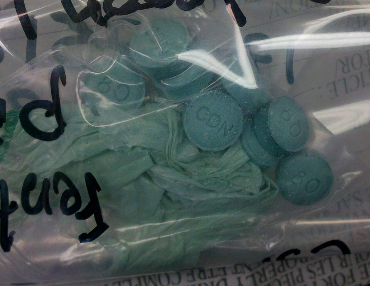 Dark green-coloured oxycodone laced with fentanyl is pictured in this handout photo.