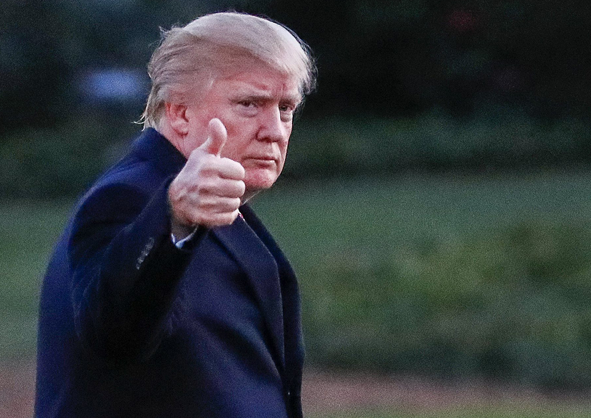 Donald Trump gives the thumbs up after disembarking Marine One walking on the South Lawn towards the Oval Office of the White House.