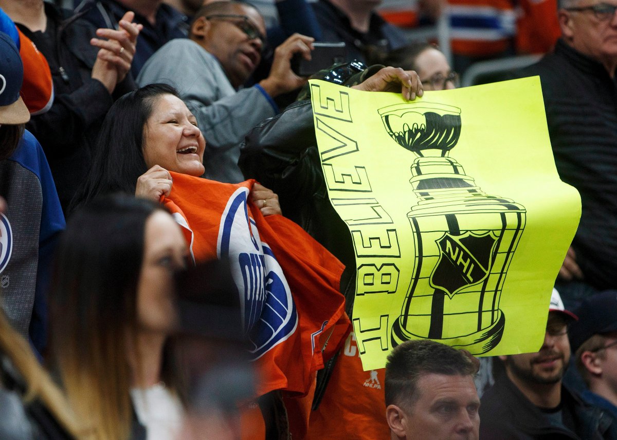 Edmonton Oilers fans celebrate their win over the Los Angeles Kings during third period NHL action in Edmonton, Alta., on Tuesday, March 28, 2017. 