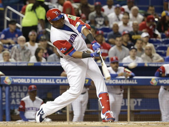 Dominican Republic's Nelson Cruz hits a double against Canada during the second inning in a first-round game of the World Baseball Classic, Thursday, March 9, 2017, in Miami.