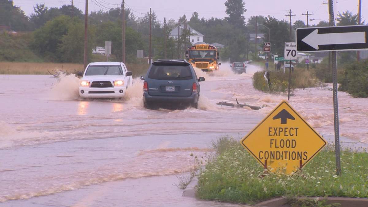 FILE: Cars drive through a flooded street in Truro in 2014. 