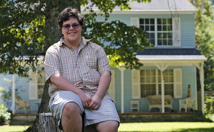 In this Aug. 22, 2016 file photo, transgender high school student Gavin Grimm poses in Gloucester, Va. In a blow to trans' rights, the Supreme Court has sent the teen's case regarding school washrooms back to a lower court without reaching a decision.
