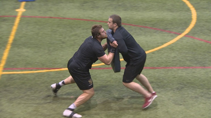Geoff Gray takes part in a blocking drill during his pro day workout. 