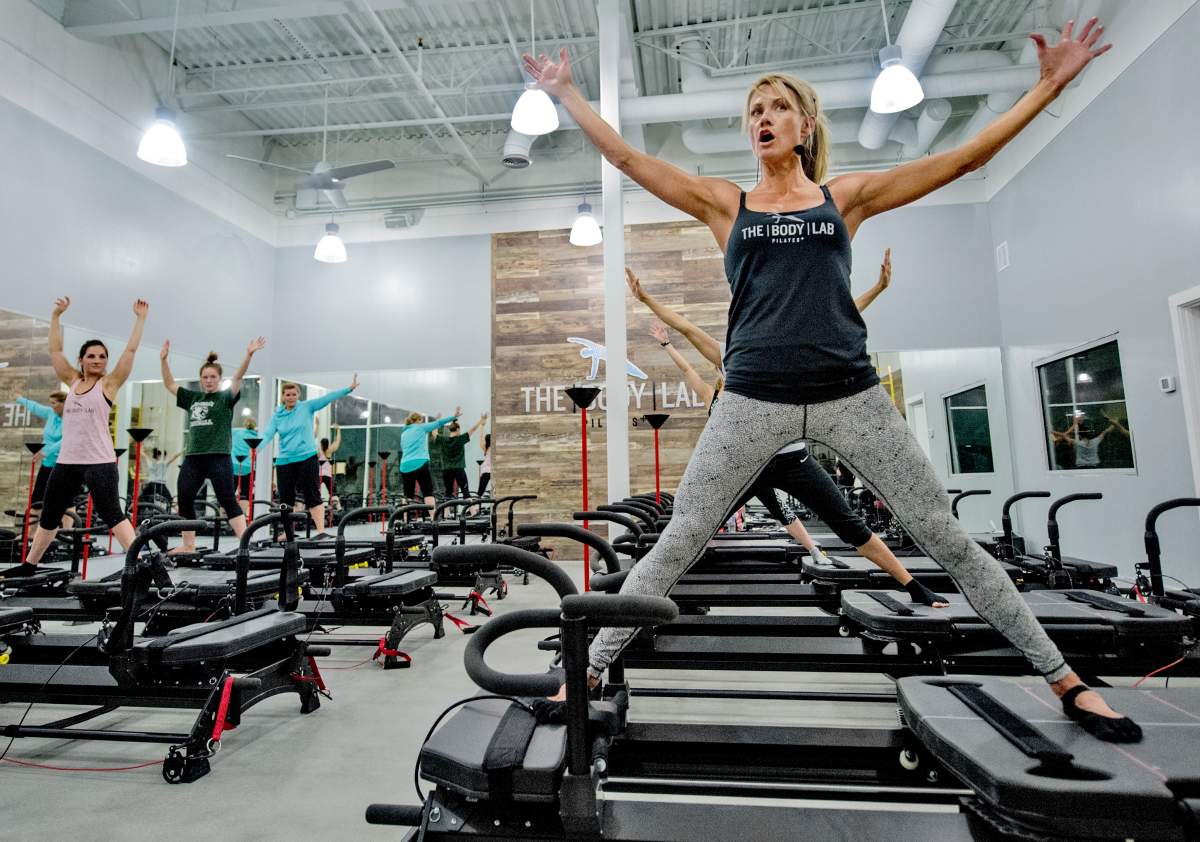 Jena Green, centre, leads an exercise class using the Megaformer M3.