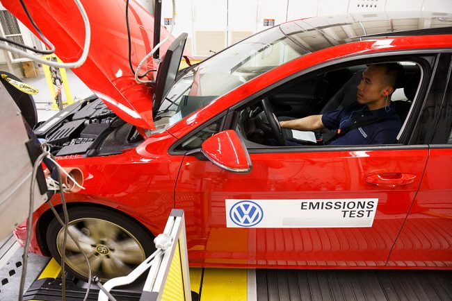 A worker tests an emissions certification vehicle inside the California Air Resources Board Haagen-Smit Laboratory in El Monte, California, U.S.,, Sept. 22, 2015.
