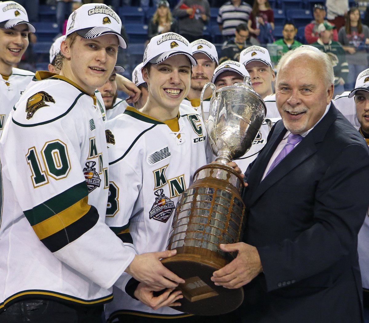 OHL Commisioner David Branch presents the J. Ross Robertson Cup to London Knights co-captains Christian Dvorak and Mitchell Marner.