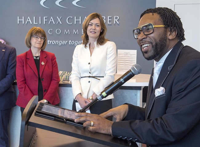 Lennett Anderson, right, senior pastor at Emmanuel Baptist Church, addresses the audience as Justice Minister Diana Whalen, left and Christine Hanson, CEO of the Nova Scotia Human Rights Commission, look on at the announcement of an online training course dealing with consumer racial profiling to educate retail businesses, in Dartmouth, N.S. on Monday, March 27, 2017. 