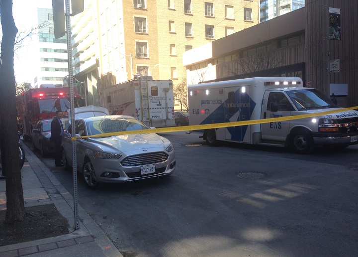 Police block off Grenville Avenue behind Toronto police headquarters on March 21, 2017 due to a suspicious package.