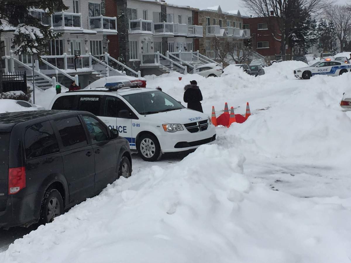 Police officers attend the scene after an 88-year-old man was found dead inside his car on March 16, 2017.