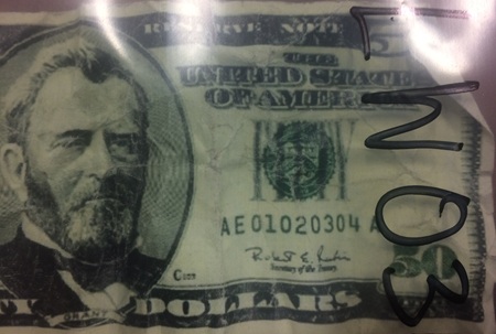 Edmonton police executed a search warrant at a home near 121 Avenue and 59 Street and found counterfeit $20 and $50 American bills printed on sheets of paper.