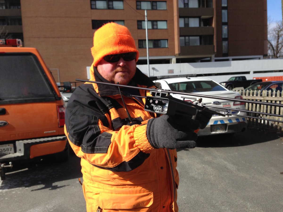 A member of Halifax Search and rescue holds up a receiver, which allows volunteers to locate vulnerable people.