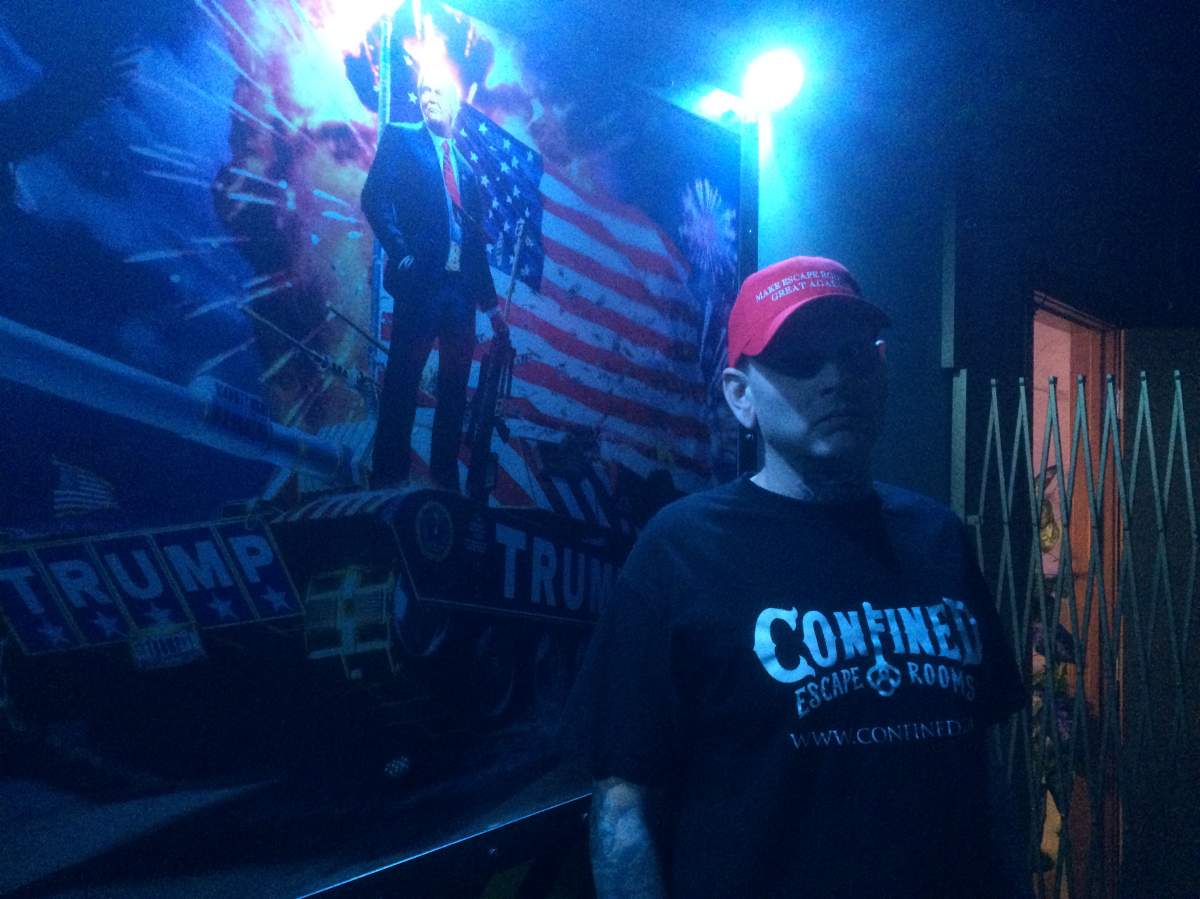 Jesse Allen poses in the Trump-themed escape room at Calgary\’s Confined Escape,